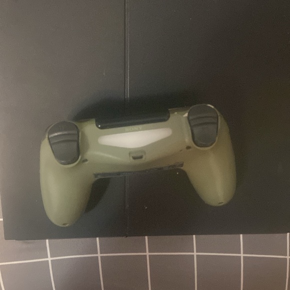 500GB PS4 with Camo controller. Has a couple games installed comes with cables